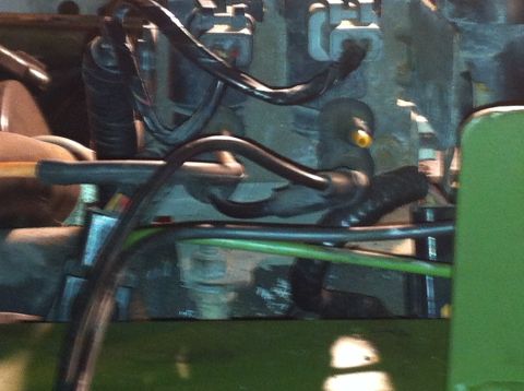 1992 Ford Bronco - Close-up view of engine components, including hoses and wiring, with visible text from Supermotors.net.