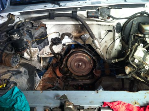 1992 Ford Bronco - Close-up view of an engine bay with transmission visible.