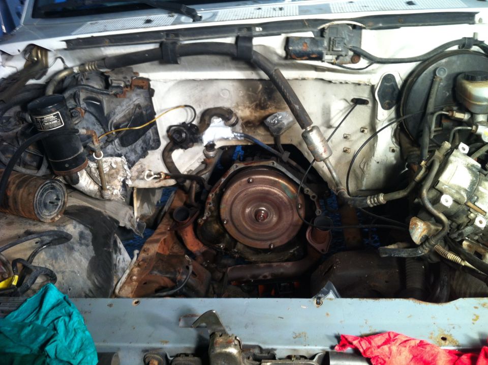 Engine bay showing transmission and engine components