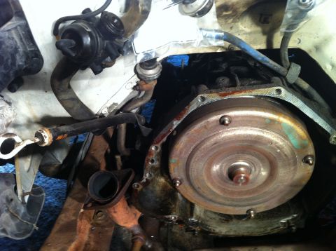 1992 Ford Bronco - This image shows a close-up view of a vehicle's transmission and associated engine components, not a complete vehicle.