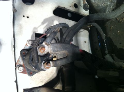 1992 Ford Bronco - This photo shows the starter solenoid and associated wiring harness, likely in the engine compartment of a vehicle.