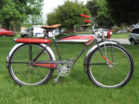 1994 Ford Bronco - A vintage bicycle with a distinctive red and chrome frame is parked on a grassy lawn.
