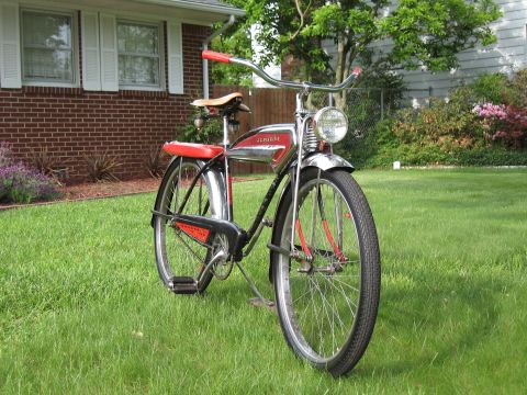 1994 Ford Bronco - A vintage bicycle with red accents and chrome details sits on a manicured lawn.