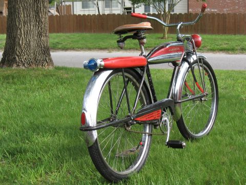 1994 Ford Bronco - This vintage bicycle features a red seat and chrome fenders, with red accents on the handlebars and frame.