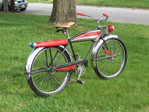 1994 Ford Bronco - A vintage bicycle with red accents and chrome fenders sits on a grassy lawn.