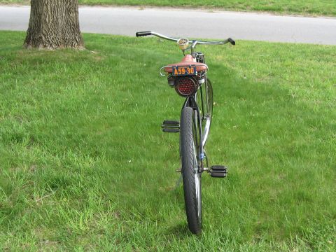 1994 Ford Bronco - This bicycle features a vintage-style red taillight and a license plate reading A59-30.