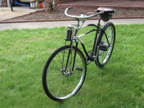 1994 Ford Bronco - A classic bicycle with a sprung front fork sits on a green lawn.