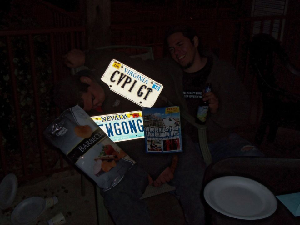 Virginia and Nevada license plates, bag of barbecue chips, and a magazine on a table