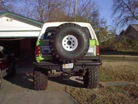 1986 Ford Bronco - As you can see it dosen't fit in my garage. Tire kind of blocks some of the view to the rear. Pivot is 3500 lb. trailer axle mounted vertic…
