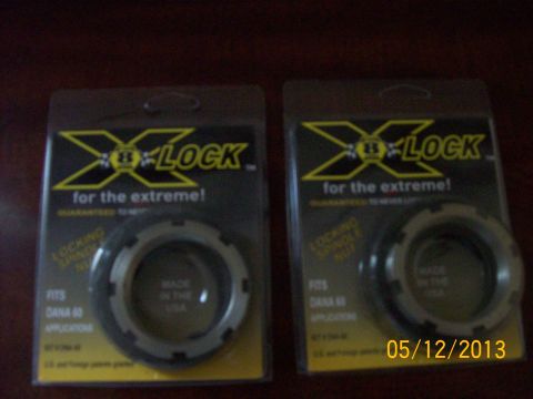 1982 Ford F-100 - Two X-LOCK locking hubs, designed for extreme use and fitting Dana 60 applications, are displayed in their packaging.