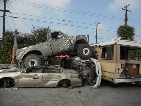 1986 Ford Bronco - Multiple vehicles involved in a collision, including a lifted truck, sedan, and bus.