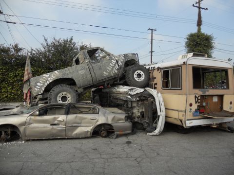1986 Ford Bronco - Multiple vehicles involved in a severe accident, piled on top of each other.