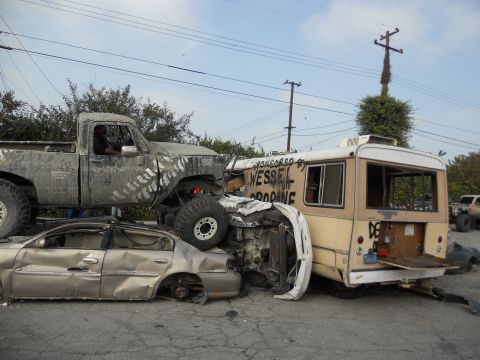 1986 Ford Bronco - Multiple vehicles are involved in a severe collision, creating a chaotic scene.