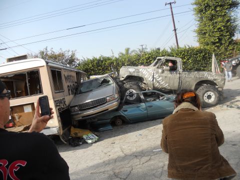 1986 Ford Bronco - A heavily modified pickup truck is shown in a junkyard scene, having crushed several other vehicles.