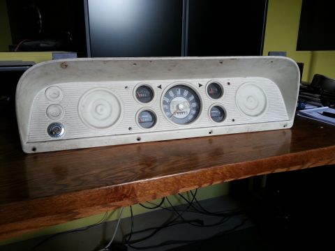 1967 Ford F-100 - Instrument cluster with speedometer, oil pressure, and temperature gauges.