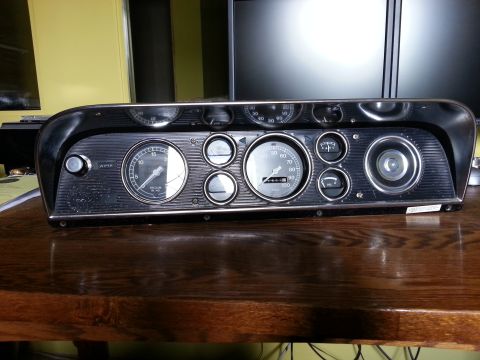1967 Ford F-100 - This 1967 Ford F-100 instrument cluster shows a speedometer, tachometer, and various other gauges.