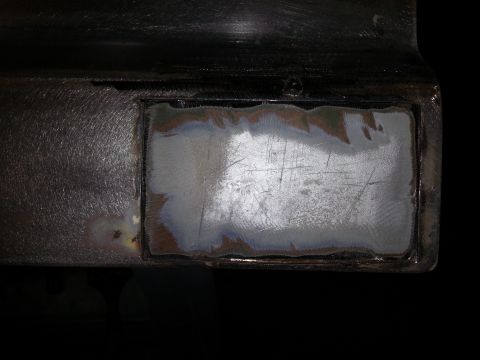 1967 Ford F-100 - This image shows a close-up view of a metal panel that has undergone grinding and preparation for repair.