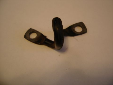 1996 Ford Bronco - A close-up view of a small, dark metal bracket with a curved loop and two holes for mounting.