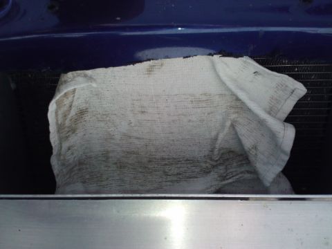 1995 Ford Probe - A cloth covers the radiator, obscuring the view of the vehicle's front end.