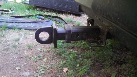 1979 Ford Bronco - Close-up of a trailer hitch receiver mounted on a vehicle's rear frame.