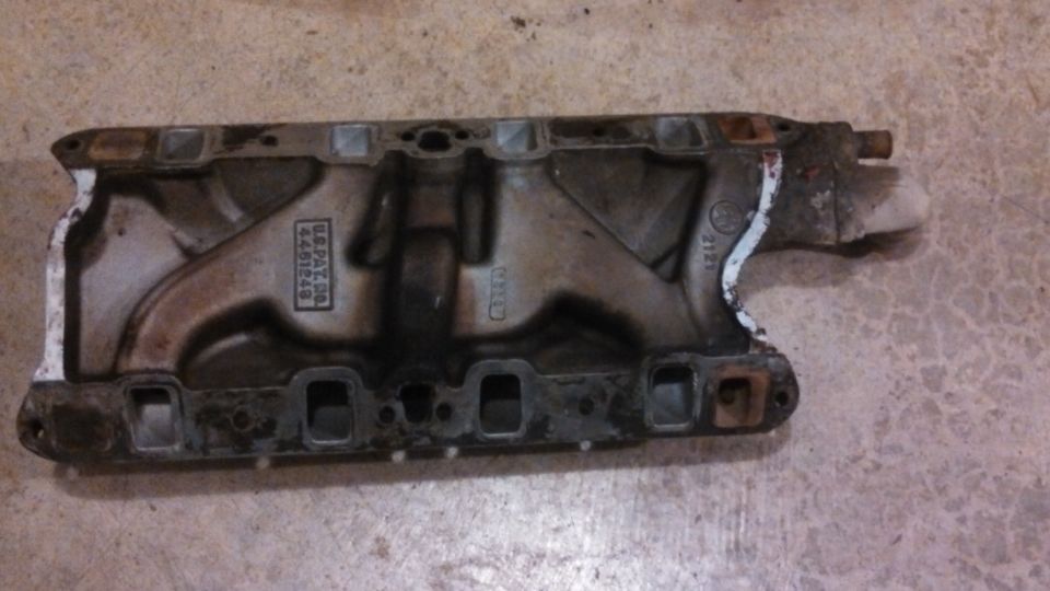 Engine intake manifold with US PAT. 4451248 stamped on it