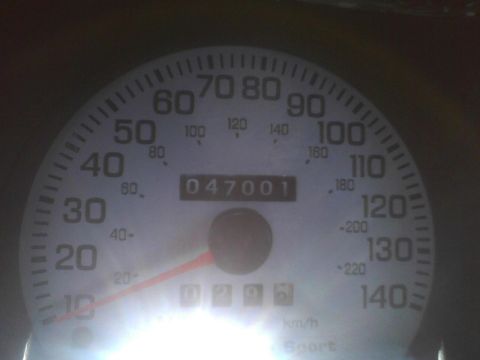 2003 Ford Crown Victoria - The odometer displays 47,001 miles, with the speedometer calibrated up to 140 mph.