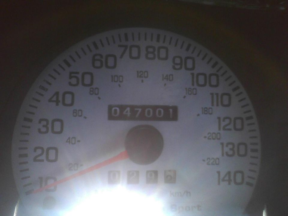Odometer shows 047001 miles. Speedometer goes up to 140