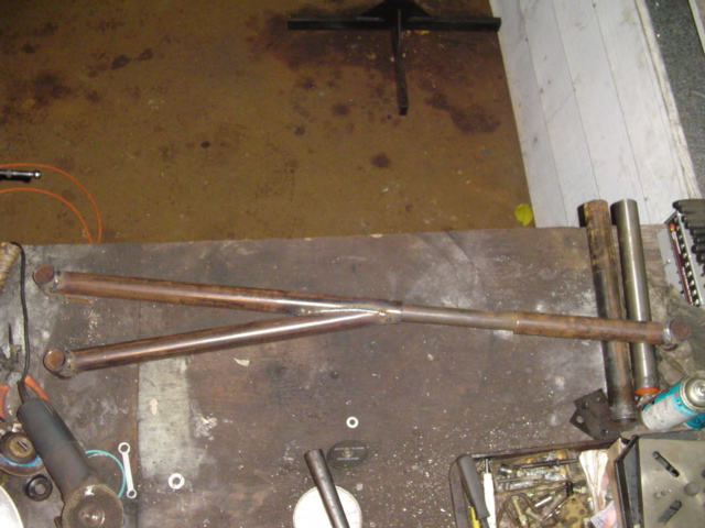 Welded antiwrap bar on workbench