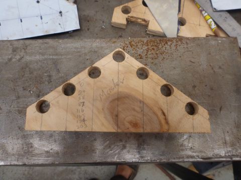1964 Mercury Monterey - A wooden jig with hand-drawn lines and measurements is shown on a workbench, possibly for a DIY project.