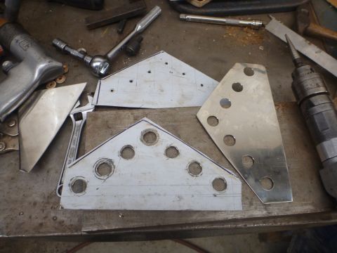 1964 Mercury Monterey - Metal parts being fabricated on a workbench with various tools present.