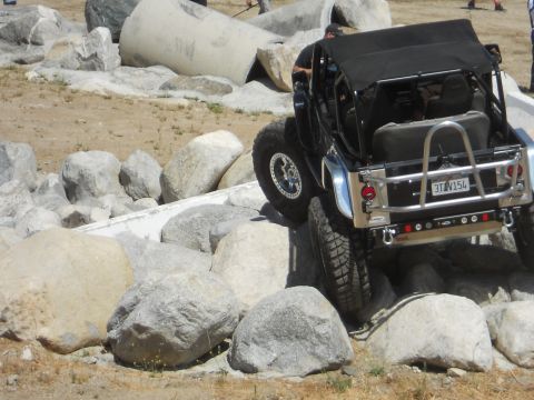 1986 Ford Bronco - An off-road vehicle navigates a rocky obstacle course.