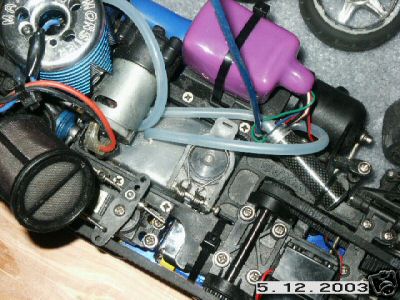 1998 Mercury Sable - Close-up view of a radio-controlled car's engine and chassis components.