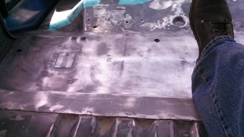 1979 Ford Bronco - Vehicle interior floor pan stripped down for repair or restoration.