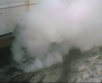 1980 Ford Bronco - A large cloud of white exhaust smoke obscures the view, with the Supermotors.net logo visible at the bottom.