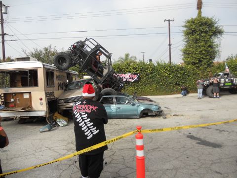 1986 Ford Bronco - A chaotic scene of multiple wrecked vehicles, including a bus and a sedan, with a buggy on top.