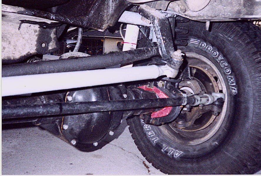 1992 Ford Bronco front axle with Pro Comp tires and SuperMotors.net watermark