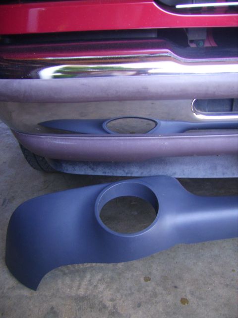 1982 Ford Crown Victoria LTD - A car bumper trim piece is shown next to a vehicle's bumper.