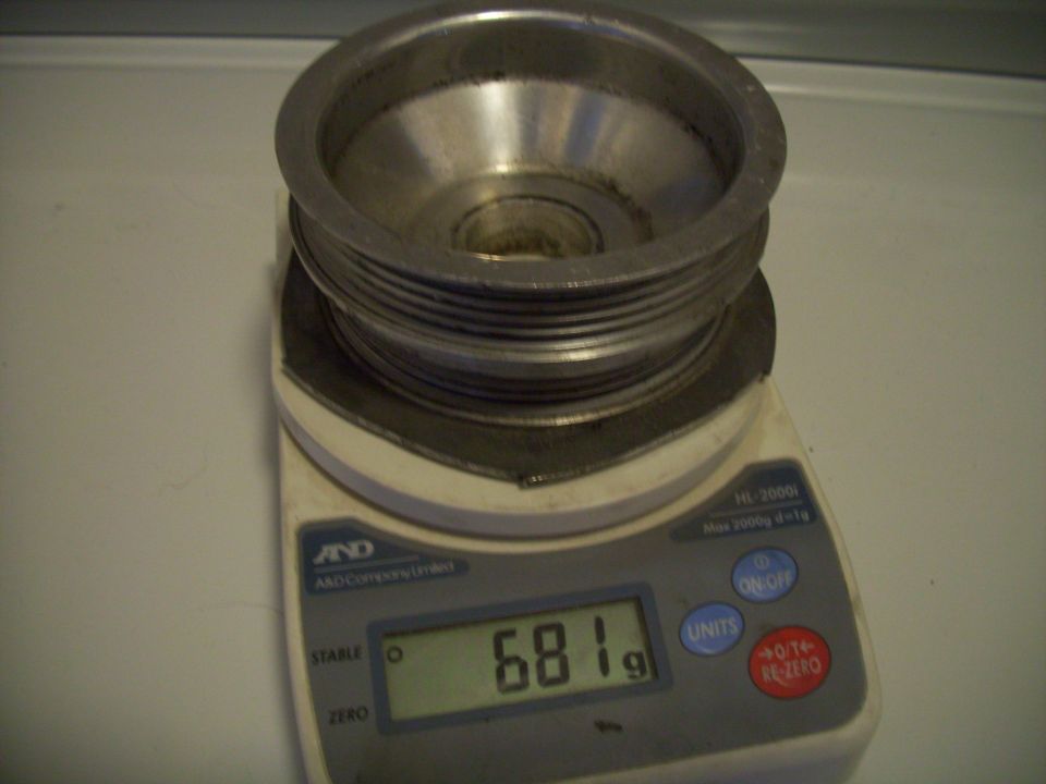 Pulley on a digital scale showing 681 grams