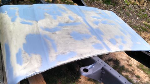 1979 Ford Bronco - Hood is prepped with body filler, ready for sanding and painting. Restoration in progress.