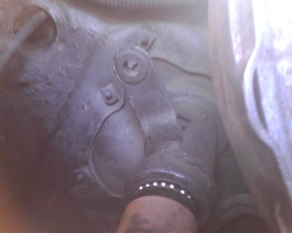 Close-up of a driveshaft U-joint with visible bearings