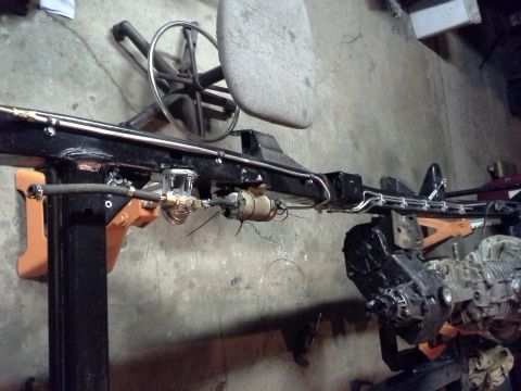 1968 Ford Bronco - Chassis frame with engine and fuel system components visible, including a fuel filter and pump.