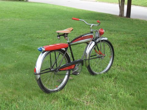 1994 Ford Bronco - A vintage bicycle with red accents and chrome fenders sits on a grassy lawn.