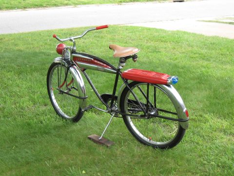 1994 Ford Bronco - A vintage bicycle with a red frame insert and chrome fenders is parked on a grassy lawn.