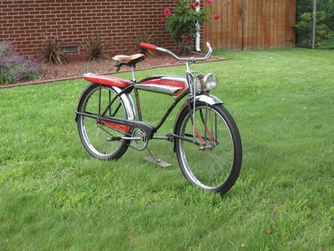 1994 Ford Bronco - A classic bicycle with chrome accents and red detailing sits on a green lawn.