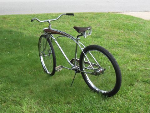 1994 Ford Bronco - This cruiser bicycle has a chrome frame, brown spring seat, and wood-grain accents.
