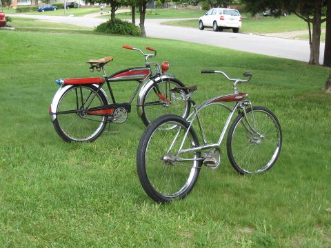 1994 Ford Bronco - Two classic bicycles are parked on a grassy lawn with a street and a white SUV visible in the background.
