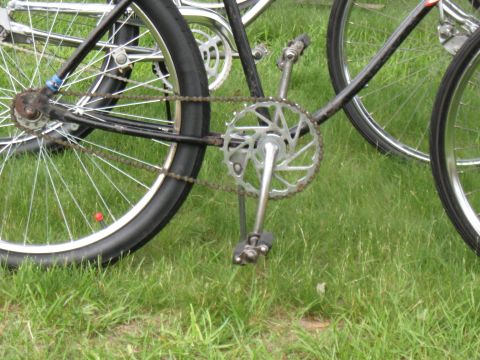 1994 Ford Bronco - Close-up view of a bicycle's drivetrain and wheels, with another bicycle visible in the background.