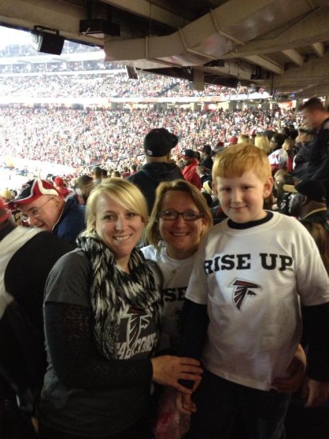 1979 Ford F-150 - Fans in stadium seating wearing Atlanta Falcons apparel.