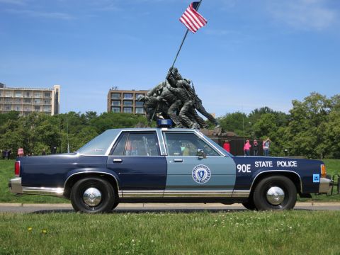 1991 Ford LTD Crown Victoria - two-tone blue 90E STATE POLICE sedan shown in profile on grass before the Iwo Jima Marine Corps Memorial.