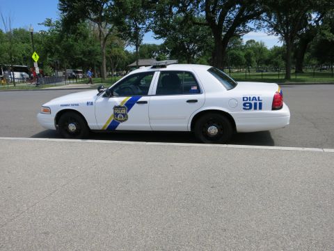 1991 Ford LTD Crown Victoria - white Philadelphia Police Highway Patrol Ford Crown Victoria sedan parked in profile by a park, marked DIAL 911 and unit H1A.